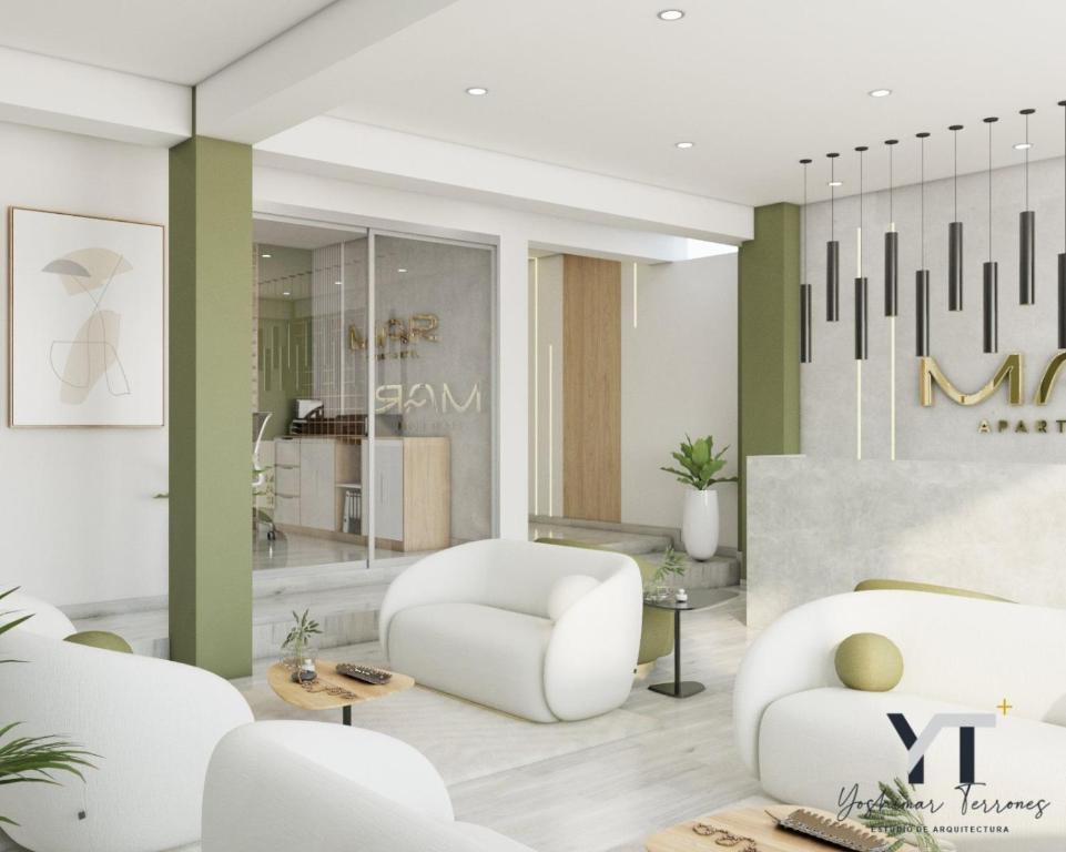 un salon avec une chaise blanche et des tables dans l'établissement Mar Apart Hotel, à Casma