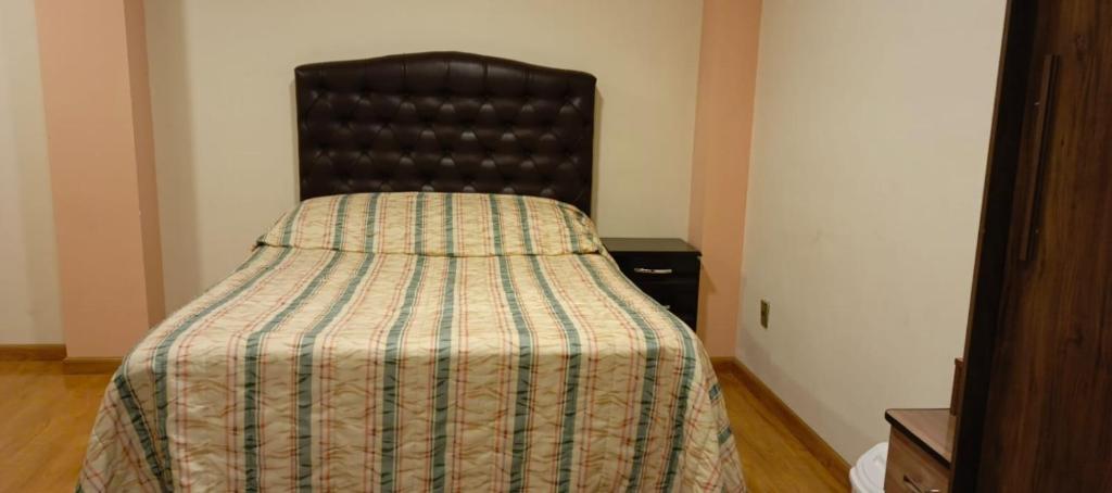 En eller flere senge i et værelse på Escarlet Sweet Home