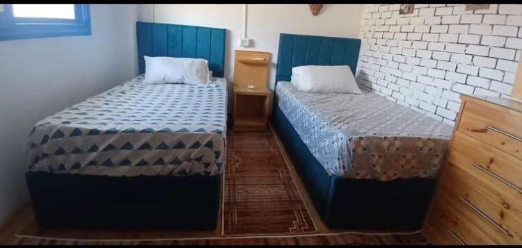 Postel nebo postele na pokoji v ubytování دهب سكوير