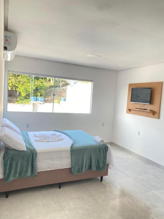 Postel nebo postele na pokoji v ubytování Suítes Central