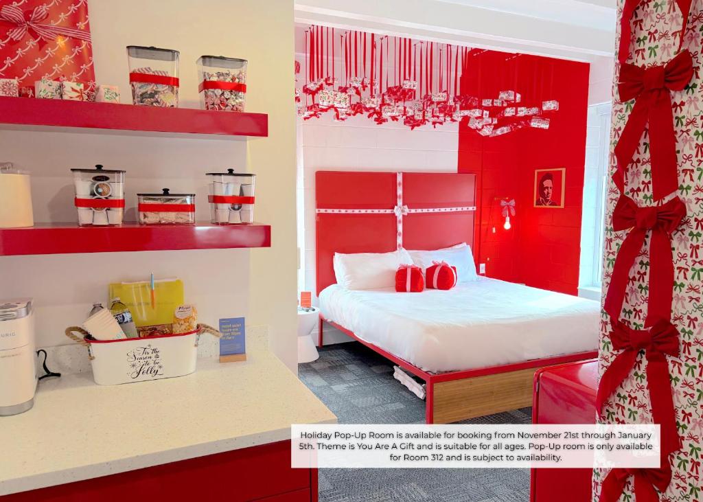 a red bedroom with two beds and red shelves at The Gallatin in Nashville