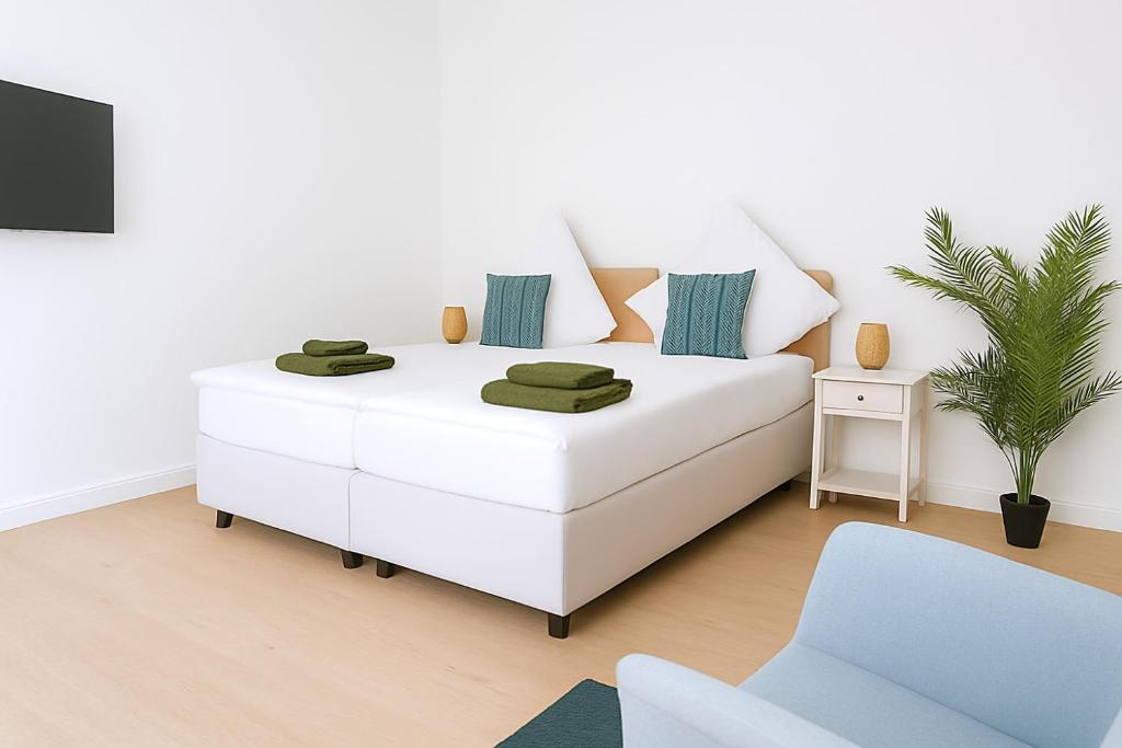 Ένα ή περισσότερα κρεβάτια σε δωμάτιο στο Top-Lage ideal für Teams & Familien mit 6 Personen