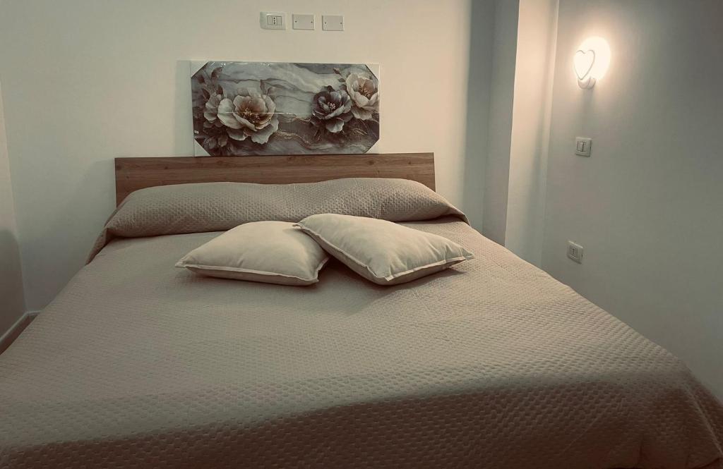 En eller flere senge i et værelse på LETIZIA'S HOME Caserta