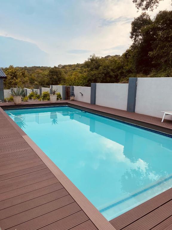 a swimming pool on the roof of a building at ALIMU villa Mbombela in Nelspruit