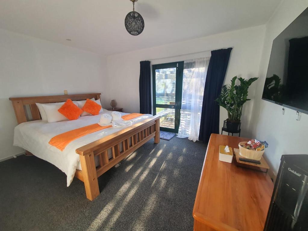 Ένα ή περισσότερα κρεβάτια σε δωμάτιο στο Cozy-in Rotorua