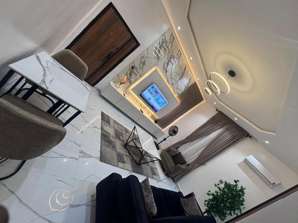 Un lugar para sentarse en Elite Suite - 1 Bed