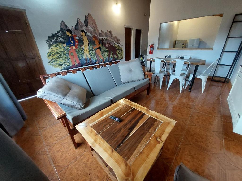 a living room with a couch and a table at Nomade bedbox Hostel in El Chalten