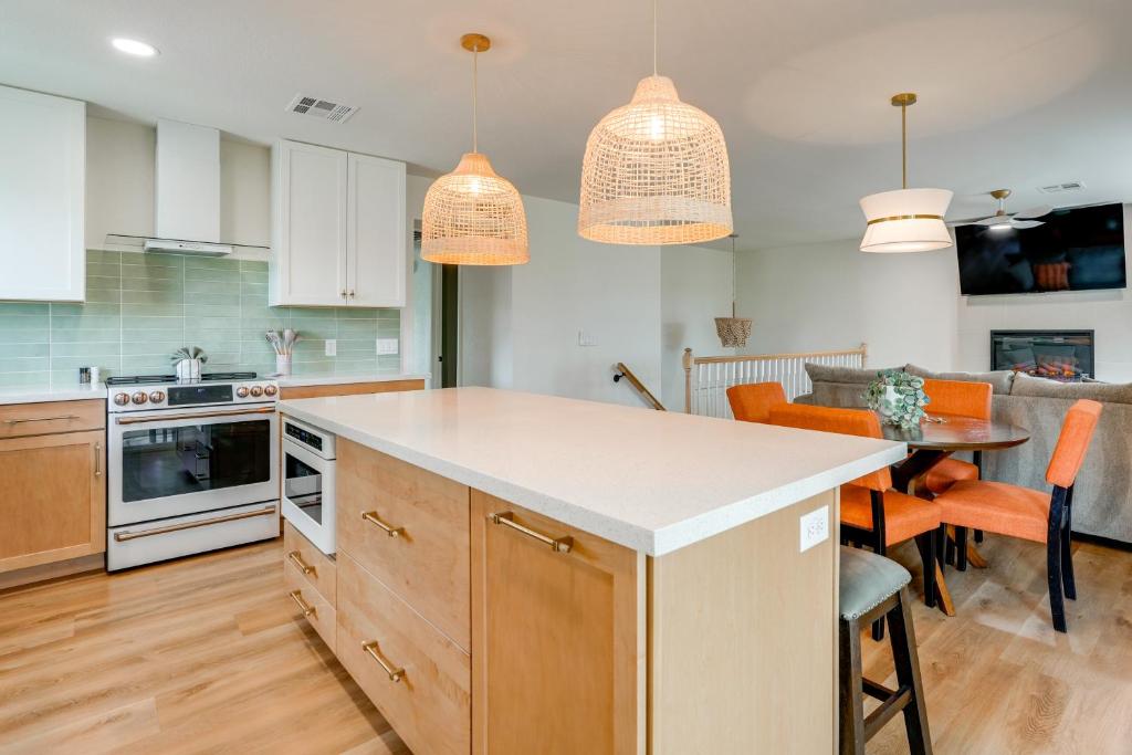 a kitchen with white cabinets and a dining room at 2 Mi to Dtwn Gorgeous Gilbert Gem with Private Yard in Gilbert