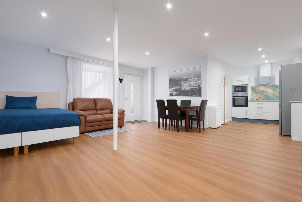 a bedroom with a bed and a table and chairs at Apartment A66 in Gründau