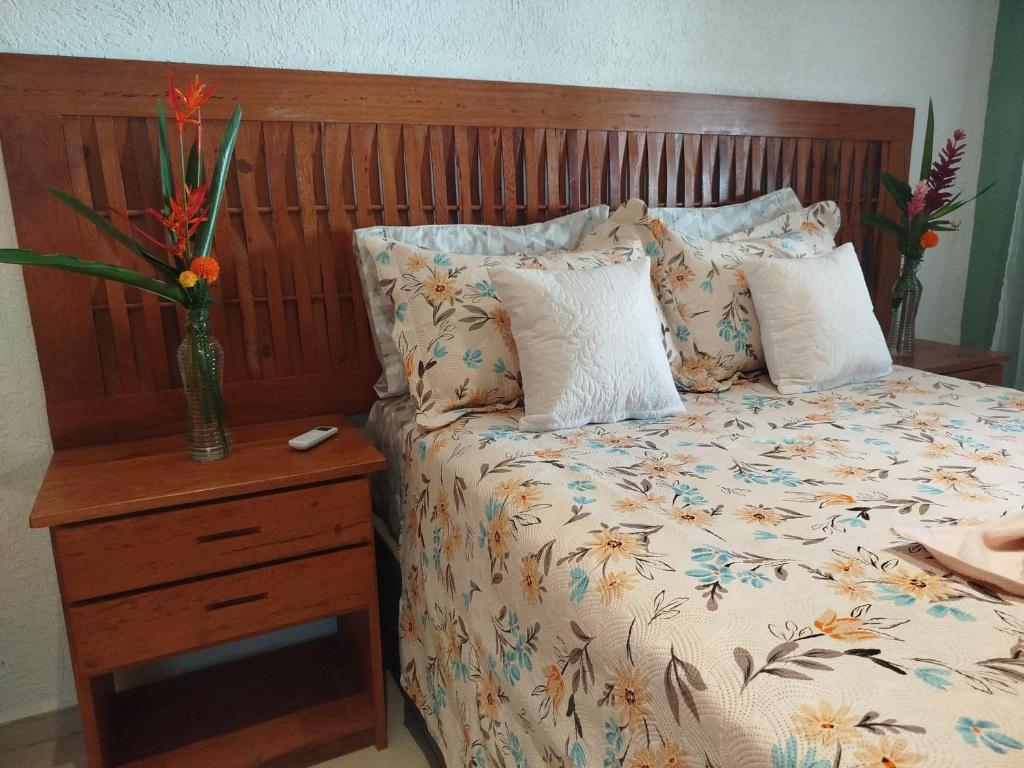 Ένα ή περισσότερα κρεβάτια σε δωμάτιο στο Casa temporada 03 quartos Arraial d'ajuda