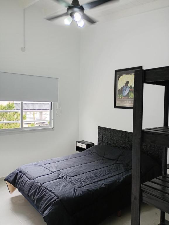 Ένα ή περισσότερα κρεβάτια σε δωμάτιο στο Jhordan II San Bernardo