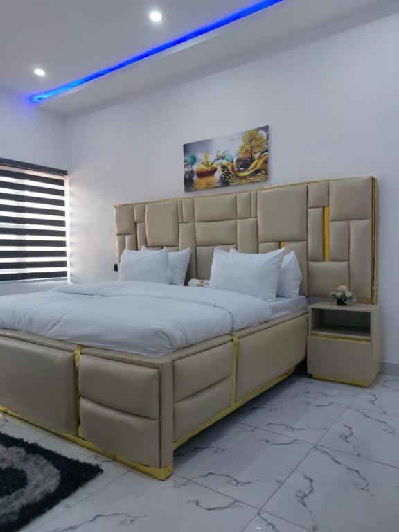 a large bedroom with a large bed in a room at 2 bedroom Apartment Lekki Ovation Terrace and extra room in Lekki