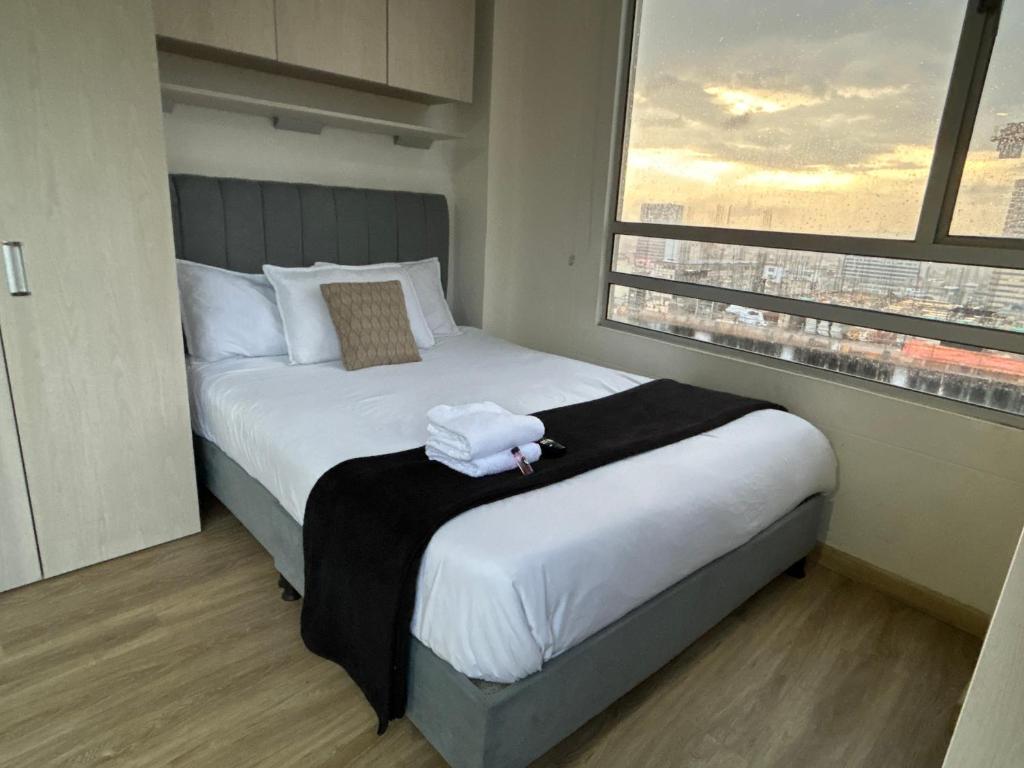 Ένα ή περισσότερα κρεβάτια σε δωμάτιο στο Bogota Luxury Loft Privado 2926