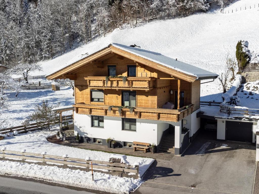 a log cabin in the snow with snow at Gastl in Hopfgarten im Brixental