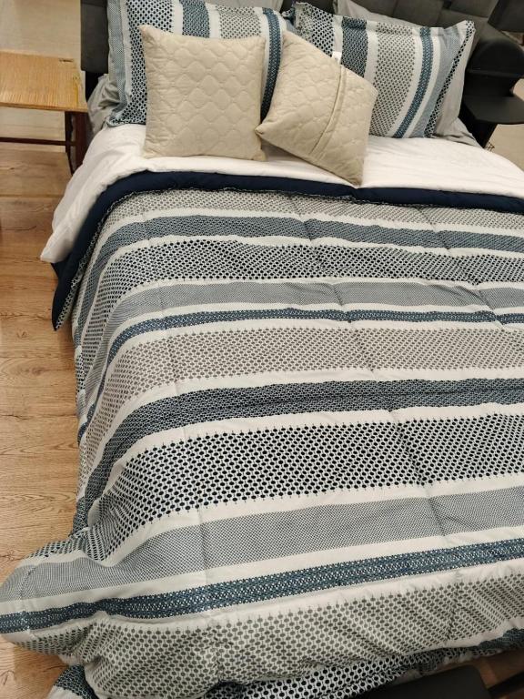 Ένα ή περισσότερα κρεβάτια σε δωμάτιο στο Departamento de tres dormitorios