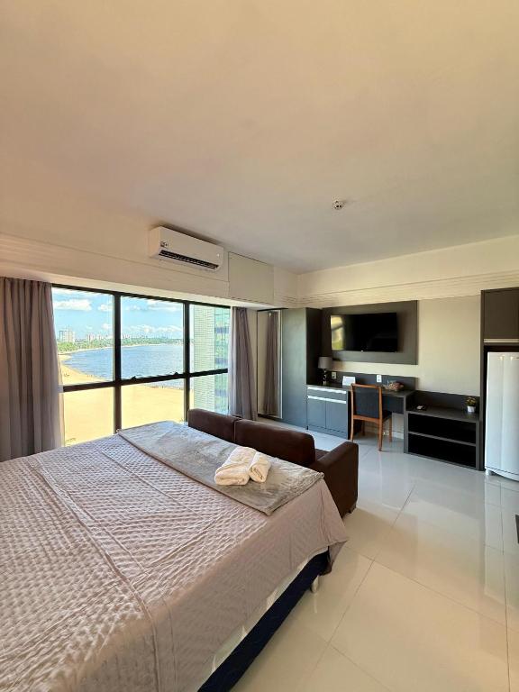 Ένα ή περισσότερα κρεβάτια σε δωμάτιο στο Loft vista ponta negra