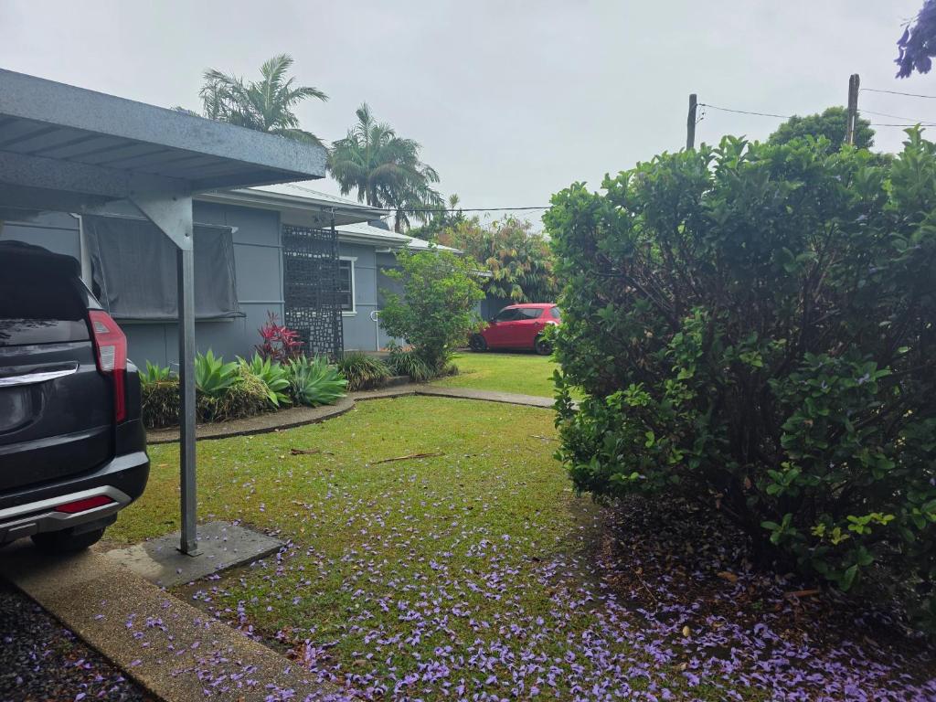 a car parked in front of a house at 2 Long between breaks in Coffs Harbour