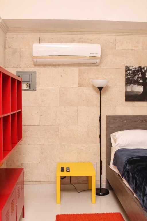 Postel nebo postele na pokoji v ubytování Apartahotel Guaraguao