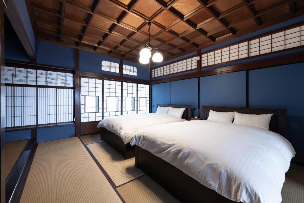 Postel nebo postele na pokoji v ubytování yado nanten