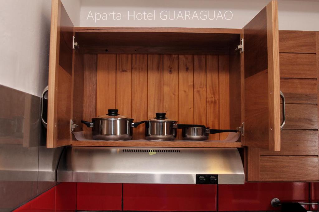 Kuchyň nebo kuchyňský kout v ubytování Apartahotel Guaraguao