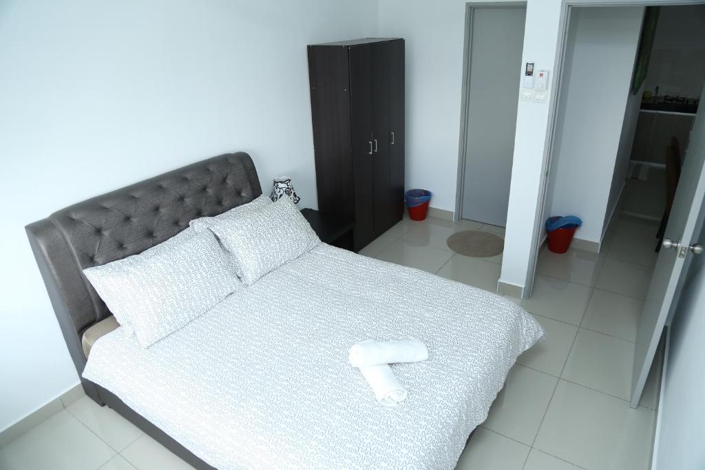 Postel nebo postele na pokoji v ubytování Palm Homestay Dwiputra Putrajaya