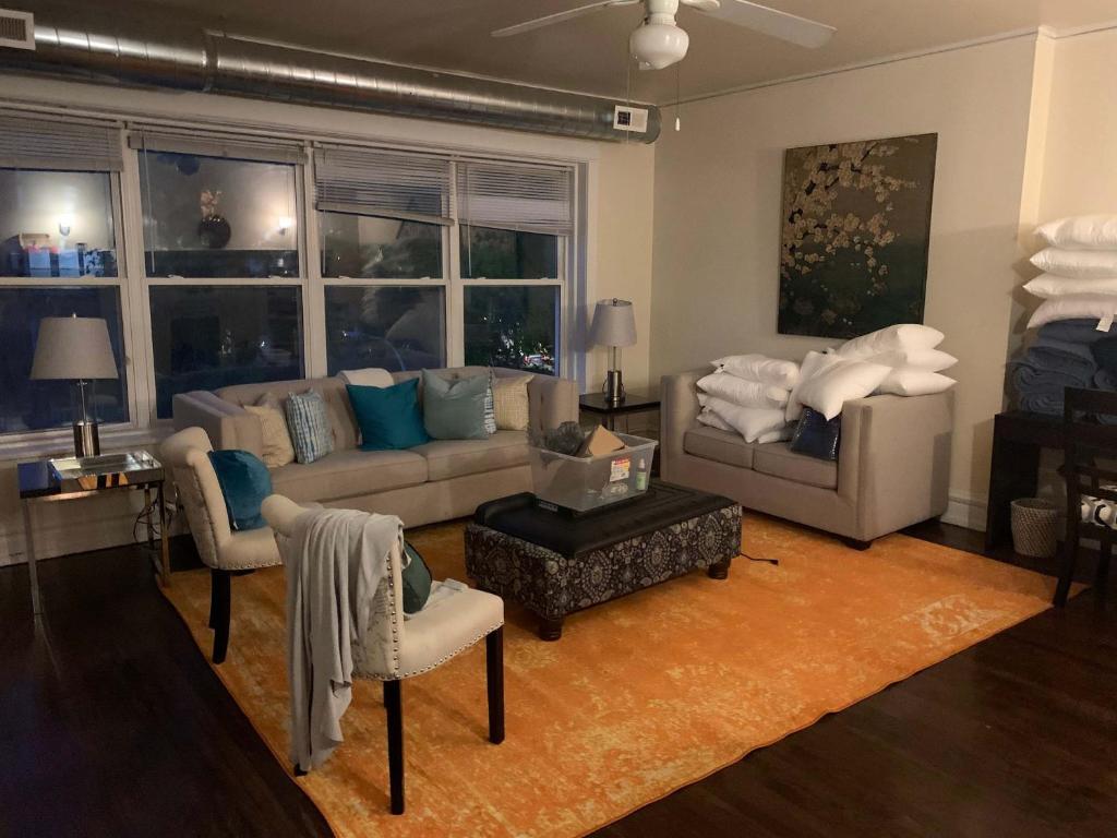 a living room with a couch and a table and chairs at North Chicago Spacious Home in Chicago