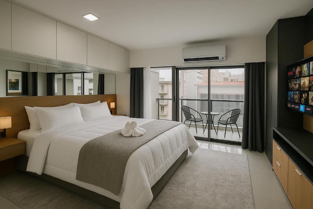 En eller flere senge i et værelse på Luxo Setin Downtown República