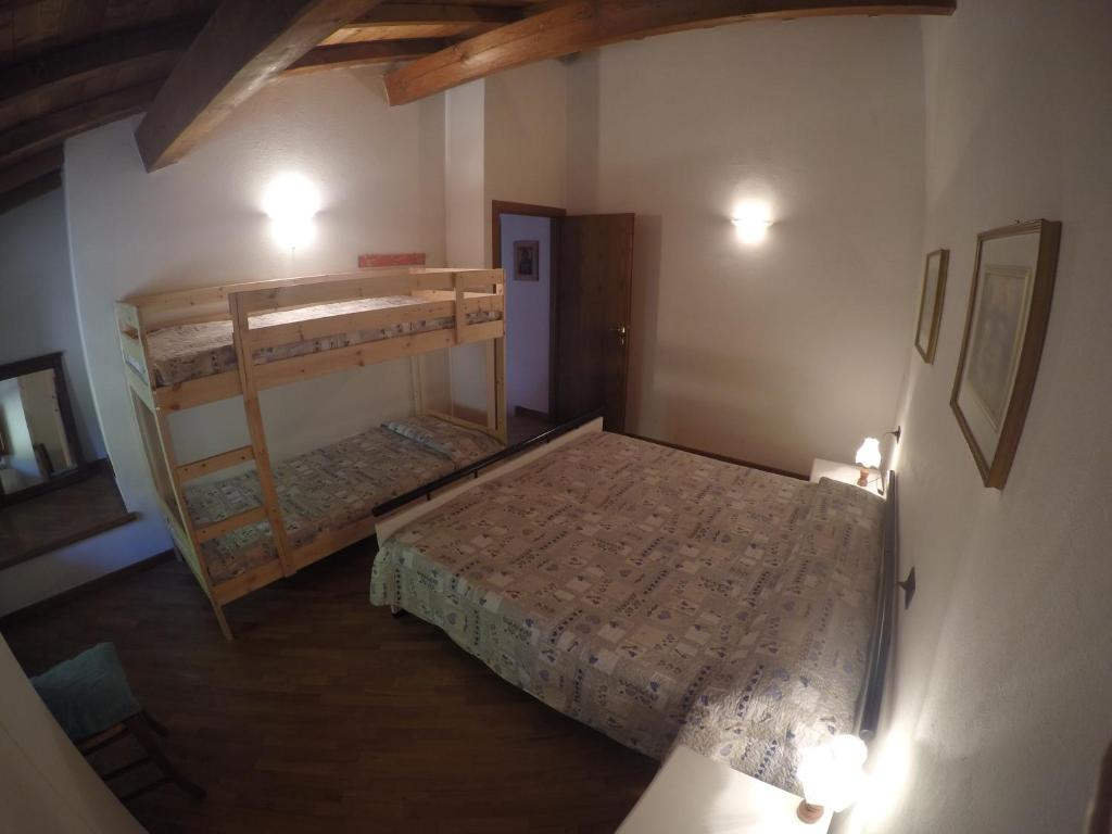 A bed or beds in a room at Podere Montestuccioli