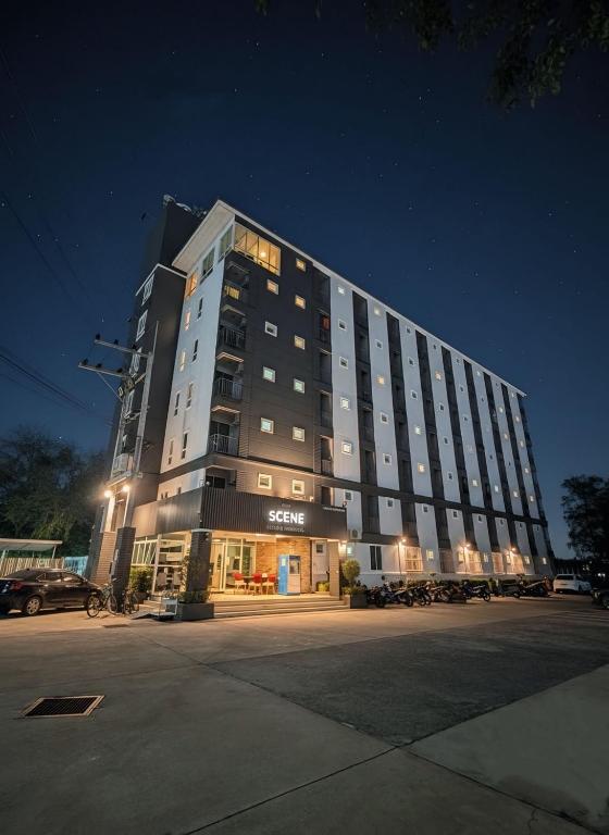 a large building is lit up at night at The Sceneสุพรรณบุรี in Suphan Buri
