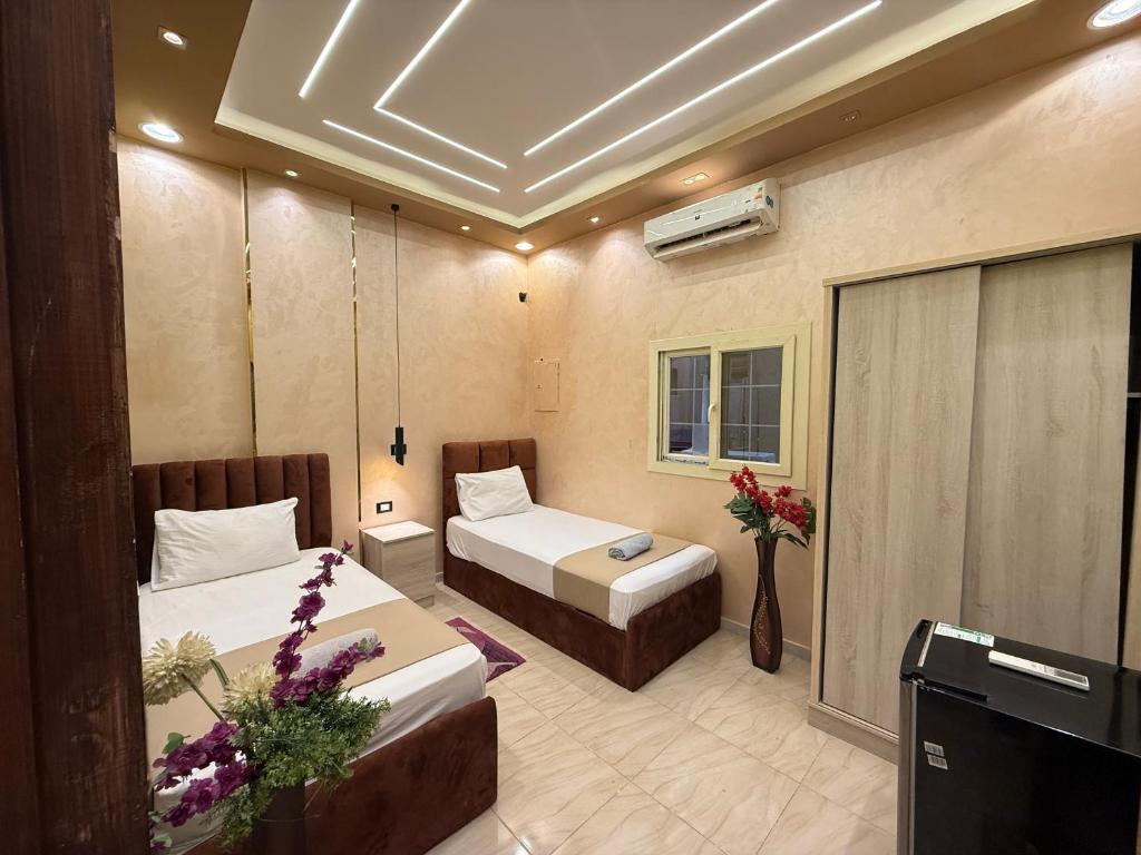 Ένα ή περισσότερα κρεβάτια σε δωμάτιο στο The Caro-Plazaro Hotel