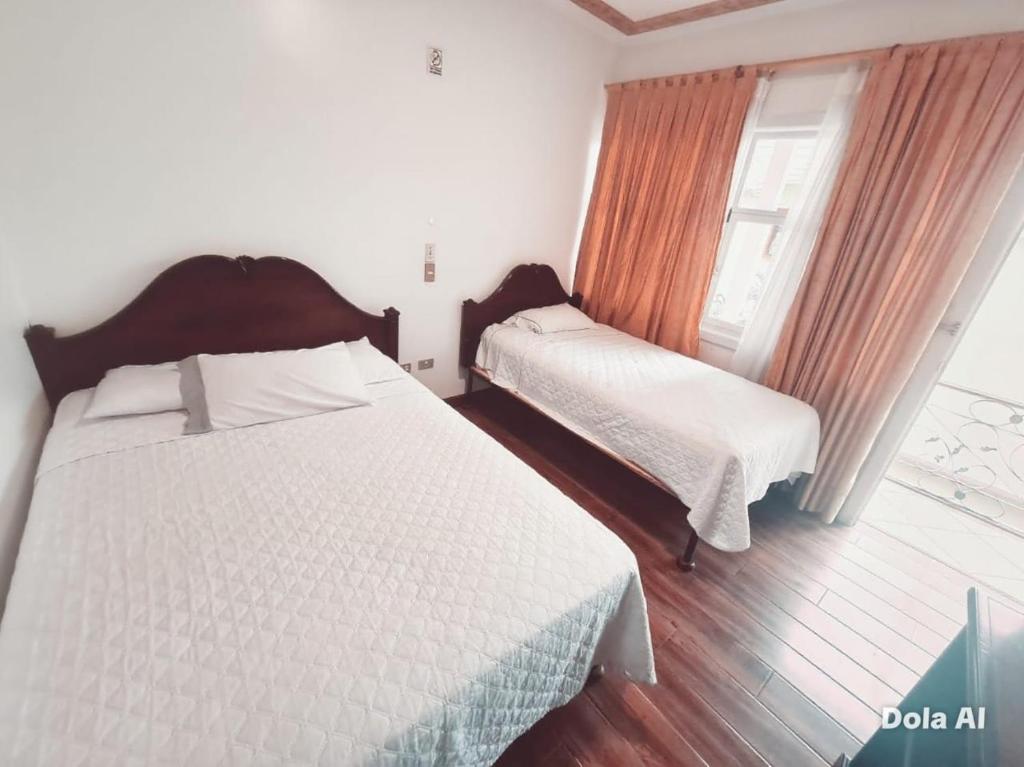 Ένα ή περισσότερα κρεβάτια σε δωμάτιο στο Estancia Grer By Chat Noir