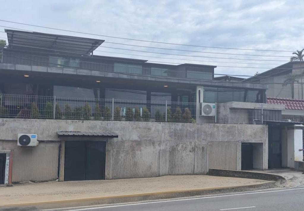 a building with a balcony on top of it at travellersloft 168 in Johor Bahru