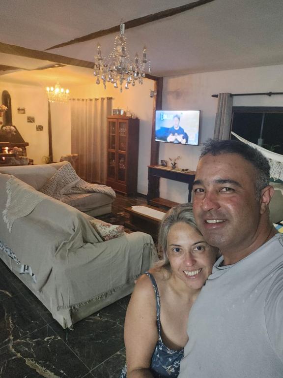 Et tv og/eller underholdning på Suítes Sonhos e Requinte