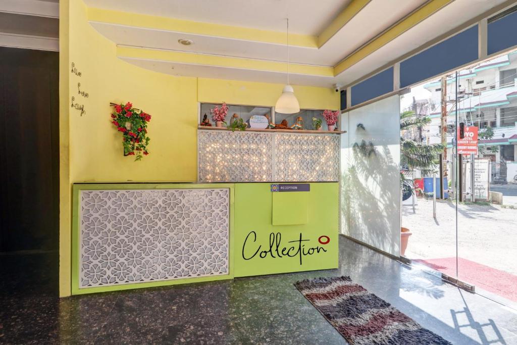 a restaurant with a sign on the side of a building at Super Capital O Qualia Gachibowli in Hyderabad