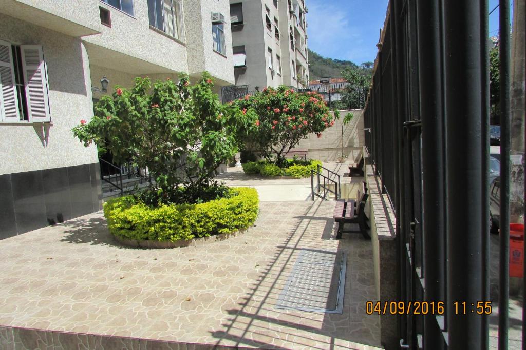 a view from a window of a courtyard with trees at Conforto Carioca Gloria in Rio de Janeiro