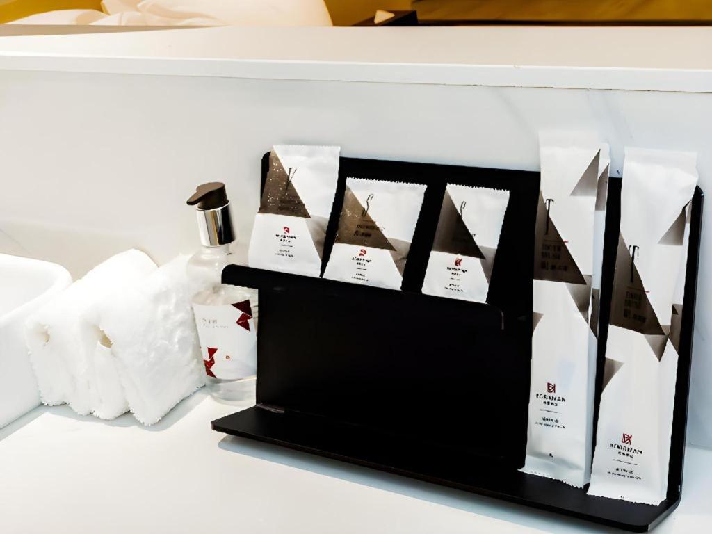 Postel nebo postele na pokoji v ubytování Borrman Hotel Jining High-tech Huangtun