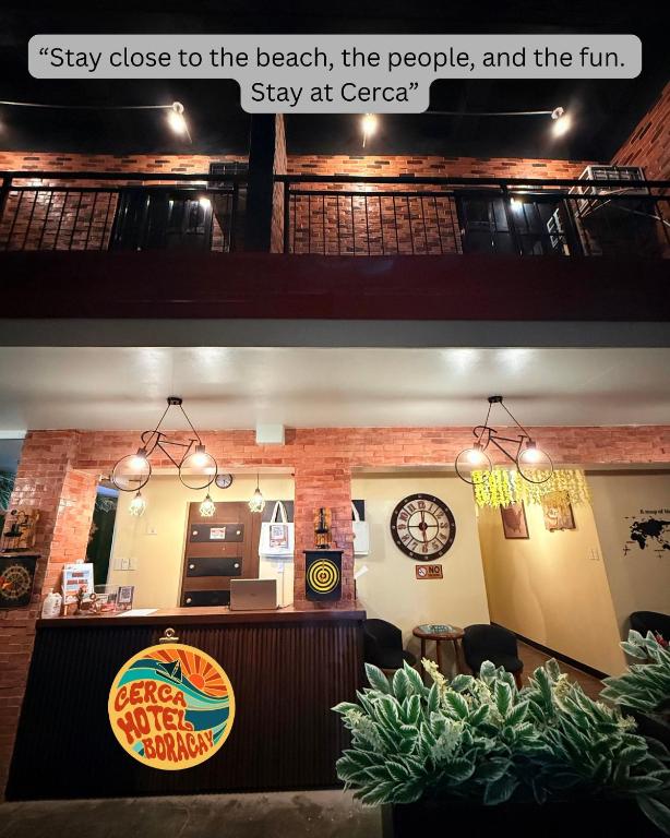 a restaurant with a counter and avertisement for at Cerca Hotel in Boracay