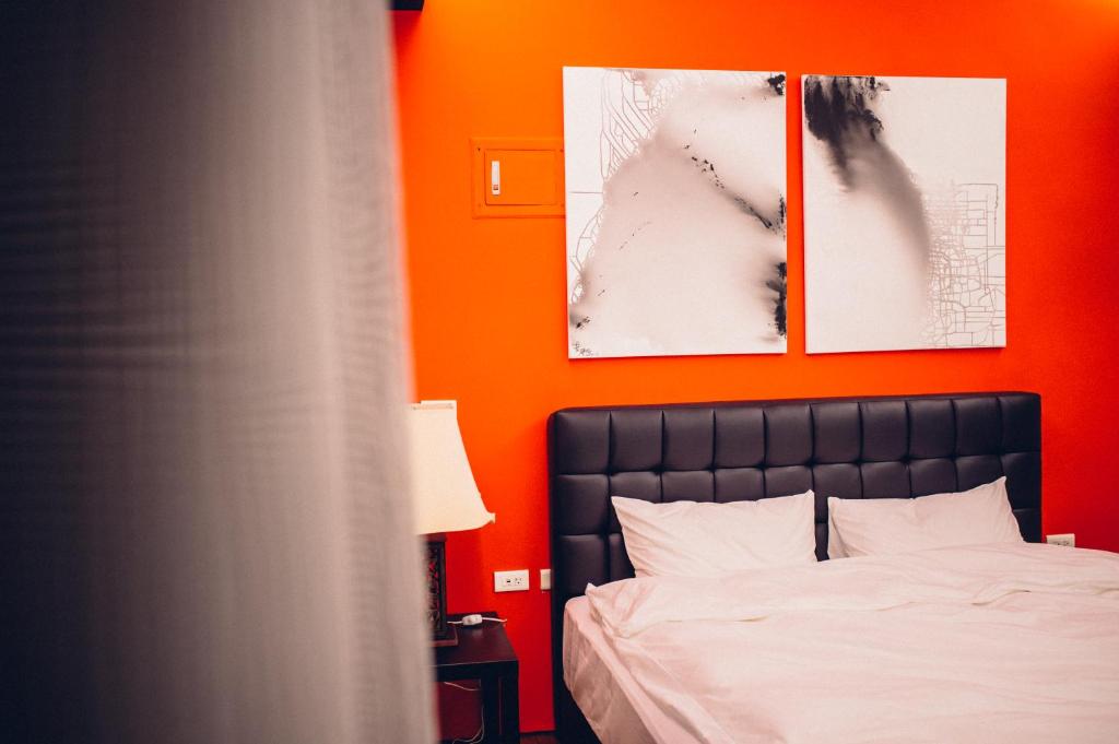 Postel nebo postele na pokoji v ubytování So Art Guesthouse 旅人藝棧民宿