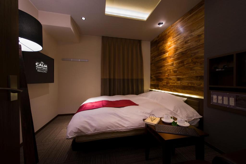 Postel nebo postele na pokoji v ubytování The CALM Hotel Tokyo