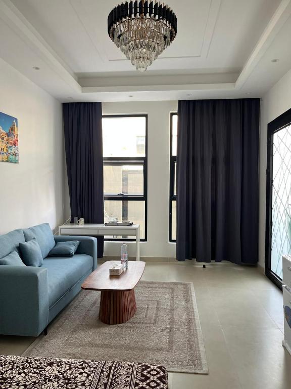 Χώρος καθιστικού στο Comfortable Studio Room in Ajman Townhouse