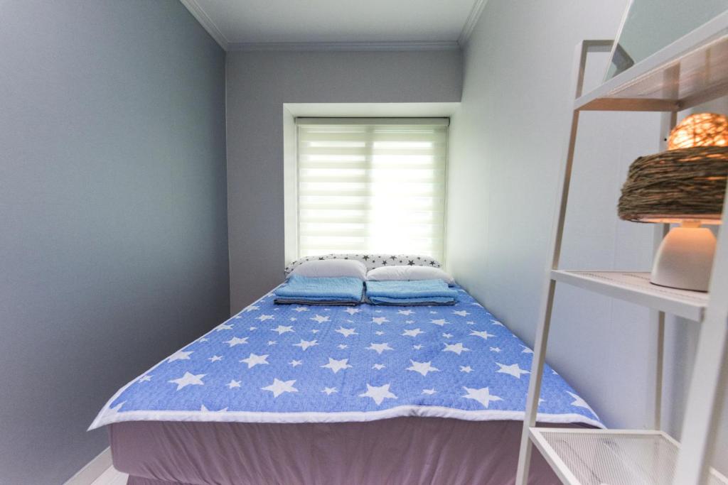 Postel nebo postele na pokoji v ubytování Cobe Guesthouse Dongdaemun