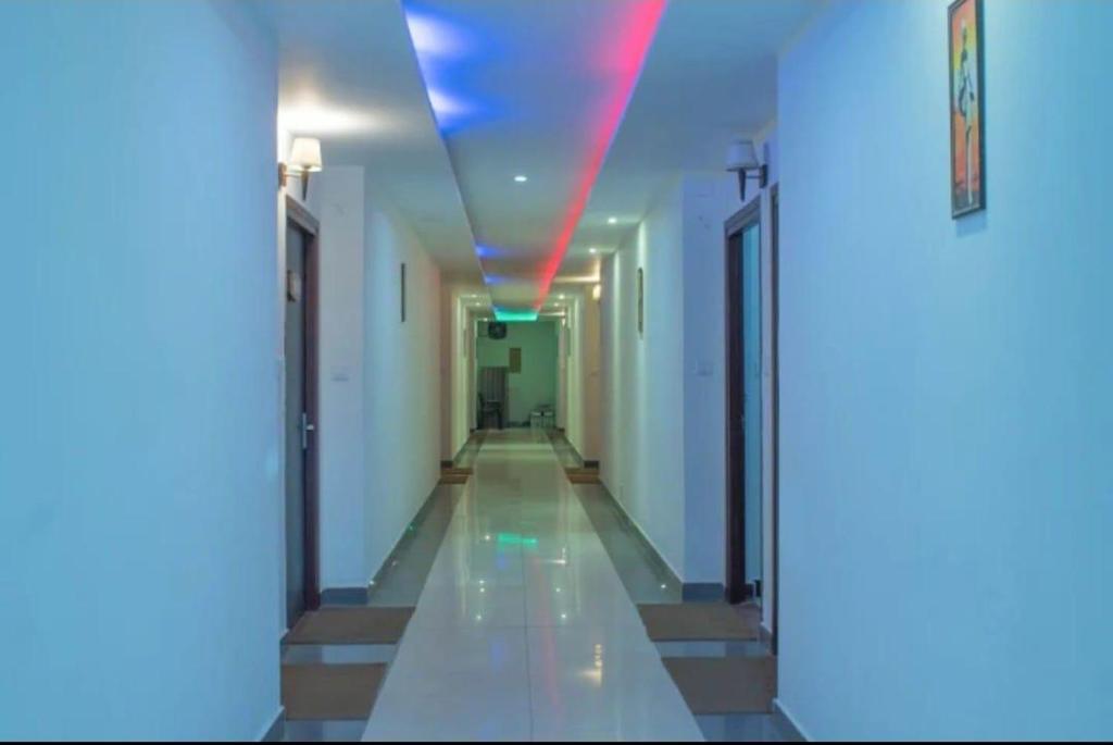 a hallway with a red light in a building at Exotic resort -basai Kashipur ramnagar road in Gaushala