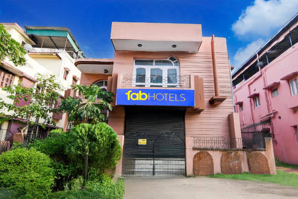 a building with a sign that reads job houses at FabHotel Samanta in kolkata