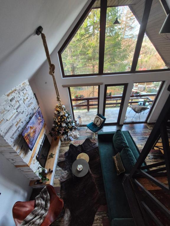 an overhead view of a living room with a large window at Wild House in Sinaia