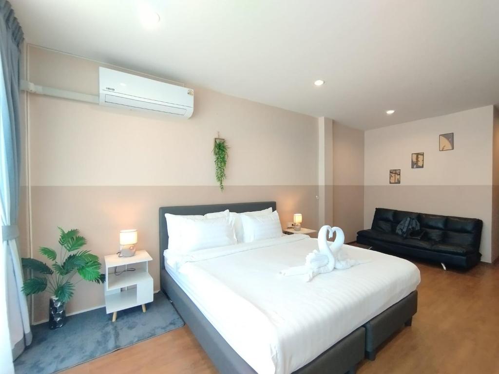 Ένα ή περισσότερα κρεβάτια σε δωμάτιο στο SSS Room Patong