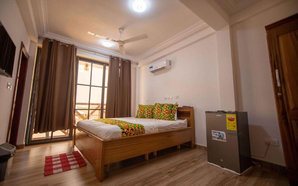 Ένα ή περισσότερα κρεβάτια σε δωμάτιο στο Aqua Makarios