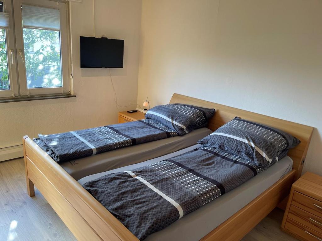 En eller flere senge i et værelse på Schönes Apartment mit Wintergarten