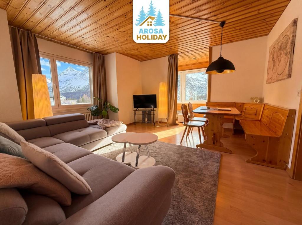 a living room with a couch and a table at Miraflor Carmen - Arosa Holiday in Arosa