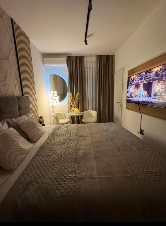 Postel nebo postele na pokoji v ubytování SpaNish FoROOM 2 apartman