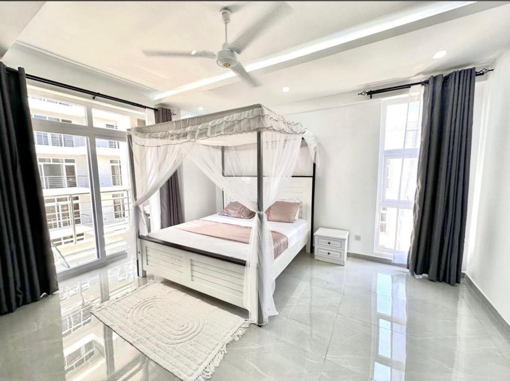 Ένα ή περισσότερα κρεβάτια σε δωμάτιο στο 3 Bedroom Mombasa Nyali